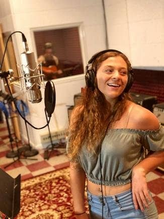 Student recording vocals in the studio at Michael Mingoia Music in Patchogue, NY