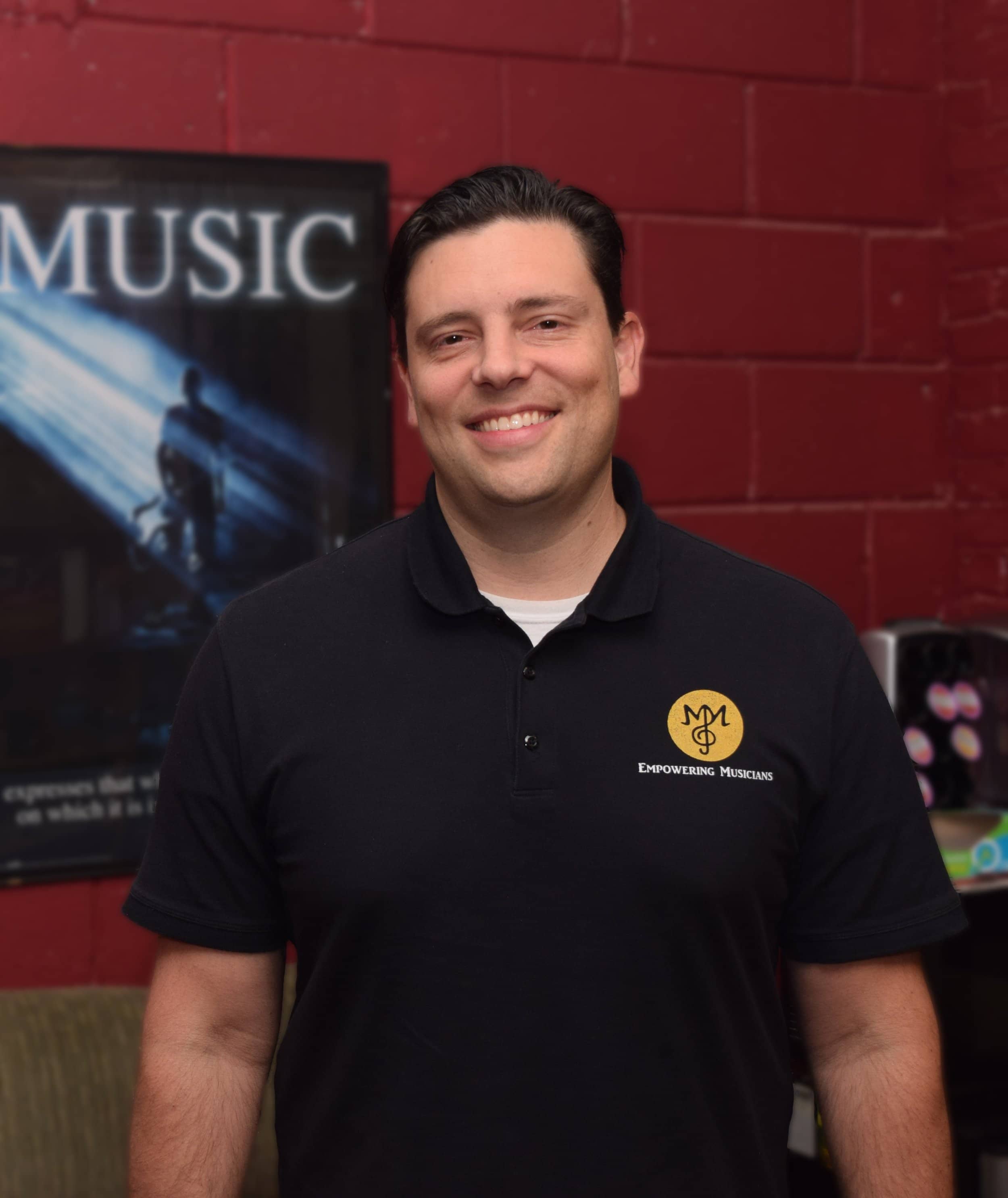 Michael Mingoia, founder and lead instructor teaching voice, piano, drums, and guitar in Patchogue, NY